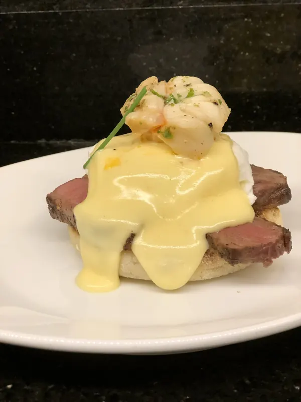 Eggs Benedict with shrimp and hollandaise
